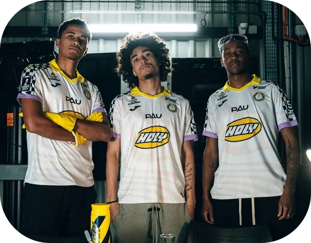 Gaming team wearing white and yellow custom esports jerseys