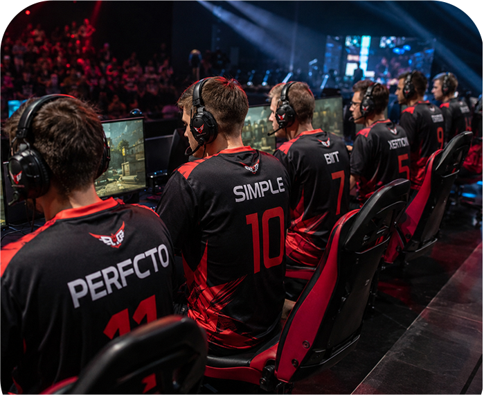 Esports team players wearing custom jerseys during a gaming tournament.